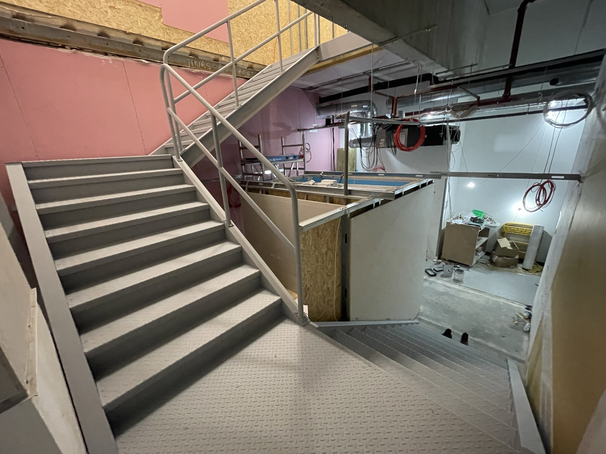 Custom commercial staircase finished in a grey oxidised primer